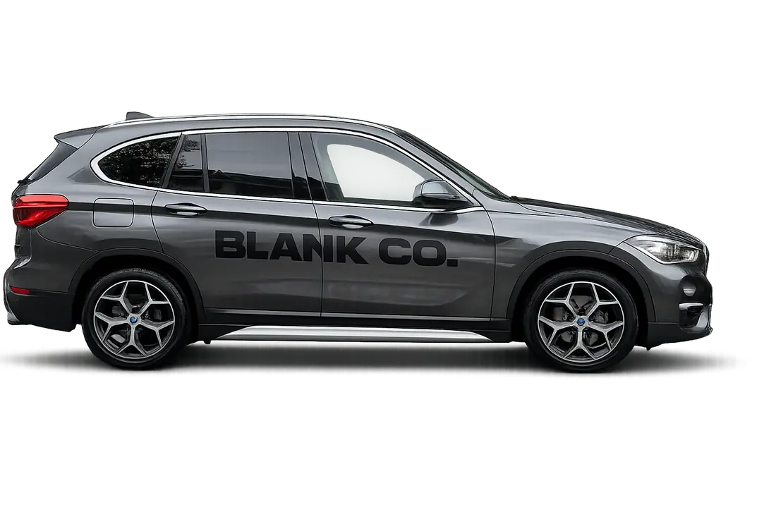 A grey SUV with BLANK CO. branding on the door